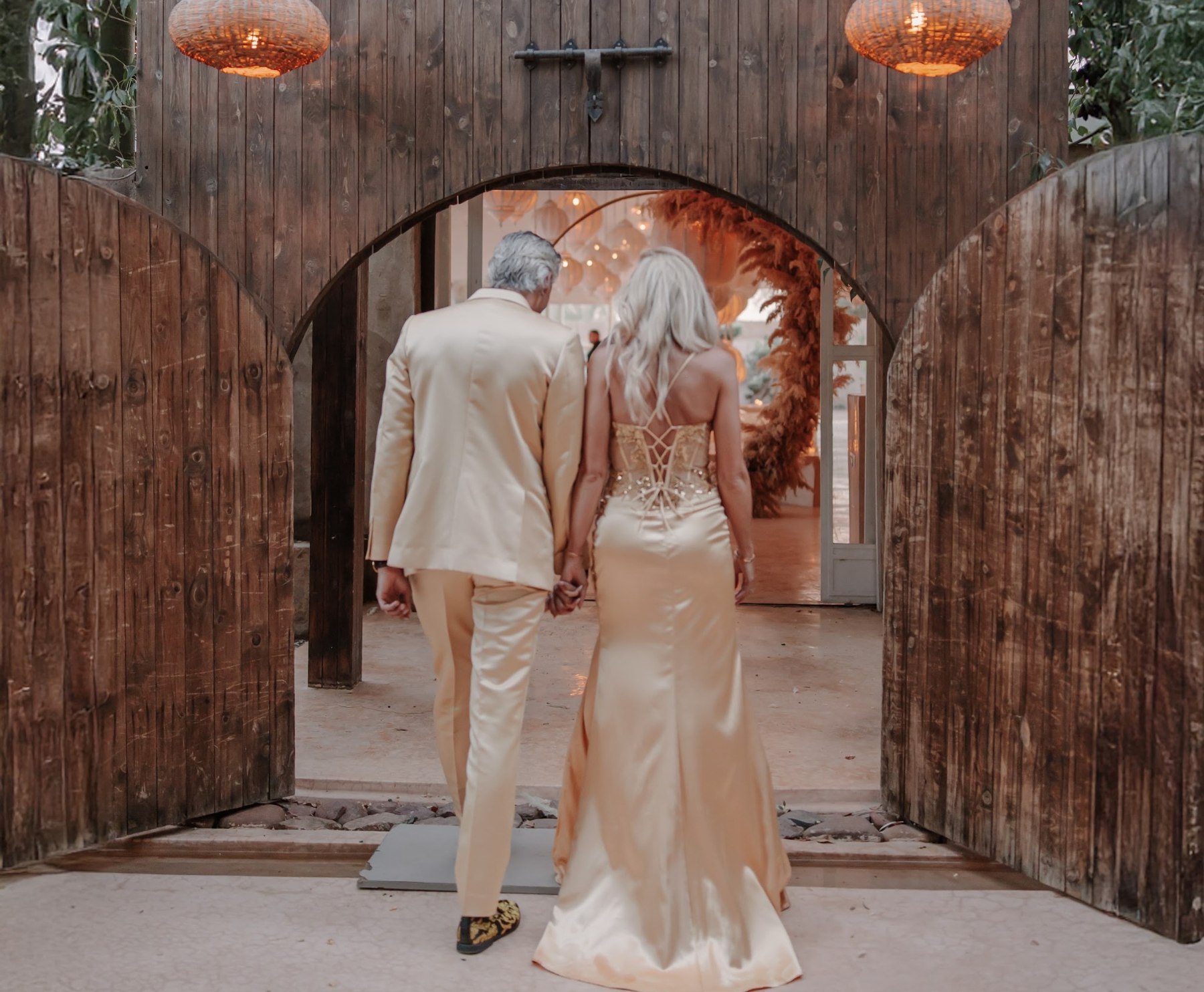 Couple entering the wedding celebration